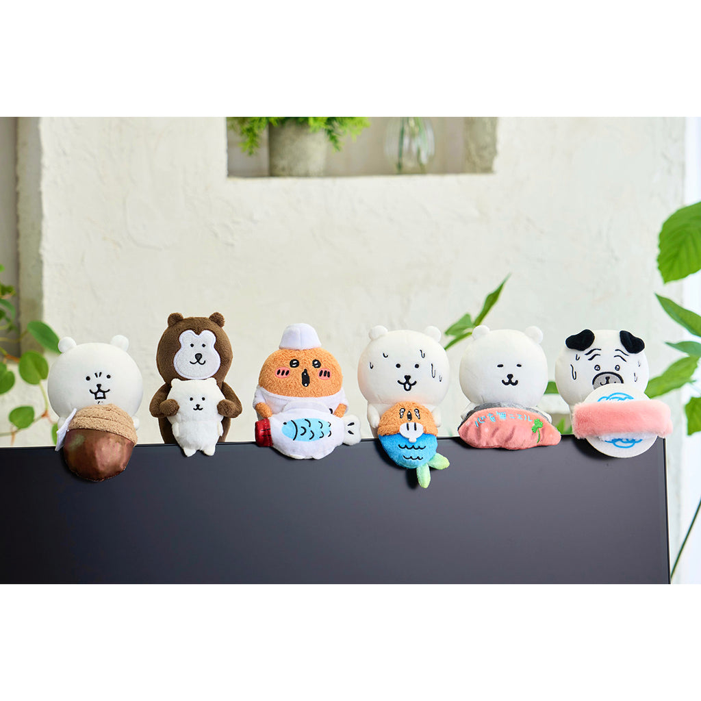 A stuffed animal watching from the Nagano Characters desktop (Infinite Sushi Pug)